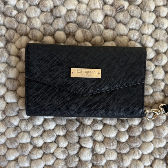 kate spade Handbags - Kate Spade Black Wristlet with Gold Accents
